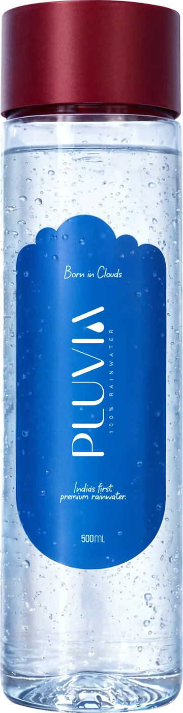 A 500 ml PET bottle of Pluvia still rainwater, clear with a deep red cap and a blue cloud-shaped label